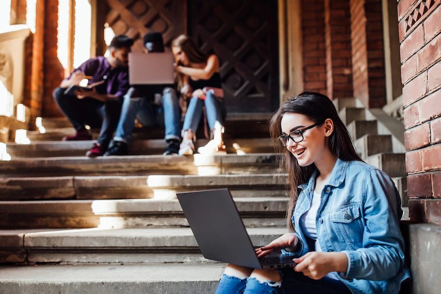 college-girl-working-with-laptop-after-lessons_496169-88